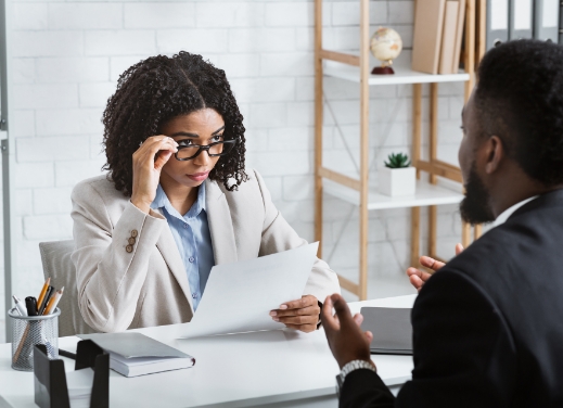 Business woman interviewing a business man.